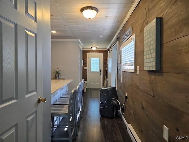 doorway to outside with wood walls, dark hardwood / wood-style flooring, and wooden ceiling