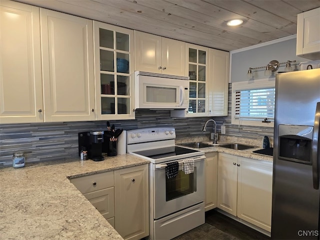 kitchen with decorative backsplash, light stone counters, wood ceiling, white appliances, and white cabinets