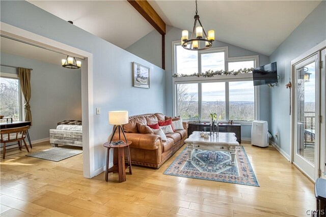 living room featuring high vaulted ceiling, beam ceiling, an inviting chandelier, and light hardwood / wood-style flooring