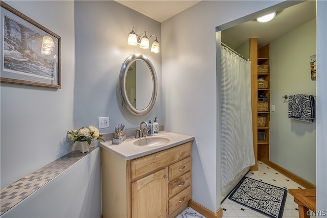 bathroom featuring tile floors and vanity