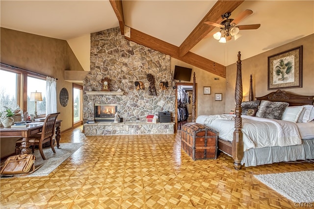 bedroom featuring a stone fireplace, beam ceiling, parquet floors, and high vaulted ceiling