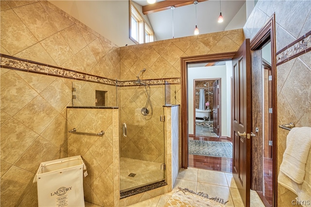 bathroom featuring tile walls, tile floors, an enclosed shower, and lofted ceiling with beams