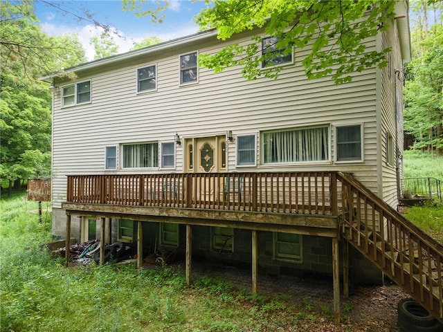 back of property featuring a deck