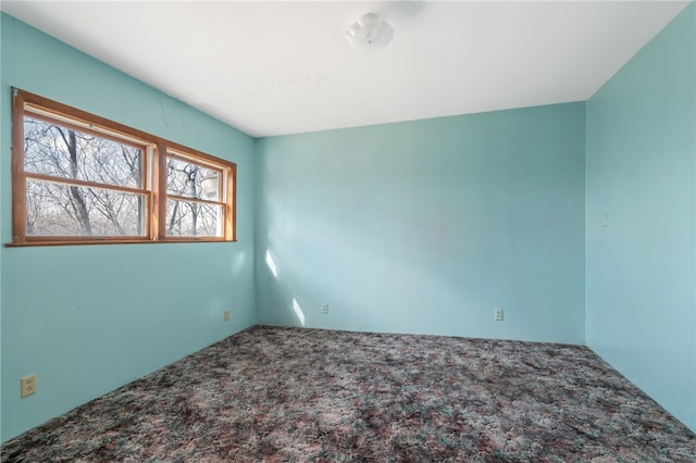 empty room featuring carpet flooring