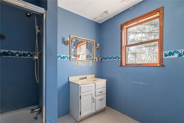 bathroom featuring vanity and washtub / shower combination