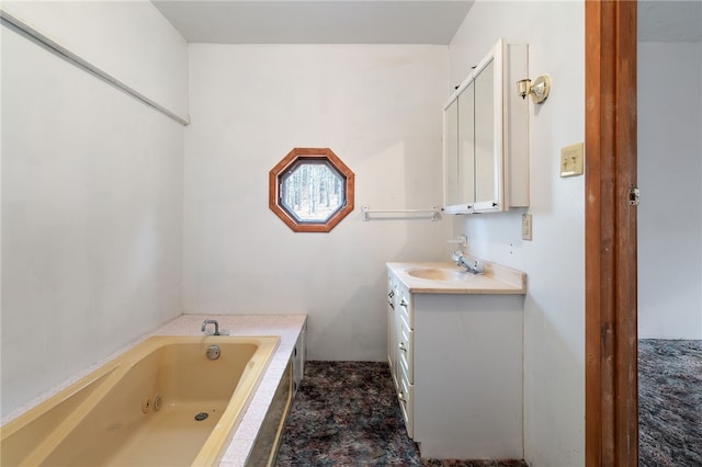 bathroom with a washtub and vanity