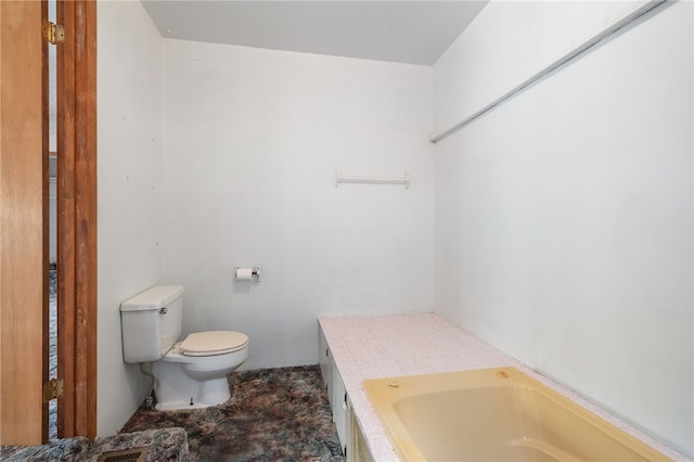 bathroom featuring toilet and a bathing tub