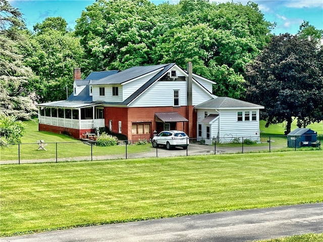 view of front of house with a front yard and a porch