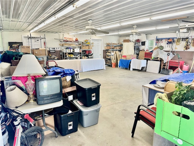 garage featuring a garage door opener and ceiling fan