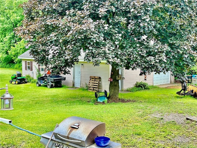 view of yard featuring a garage