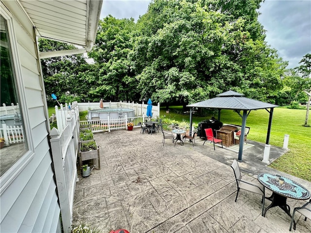 view of patio featuring a grill