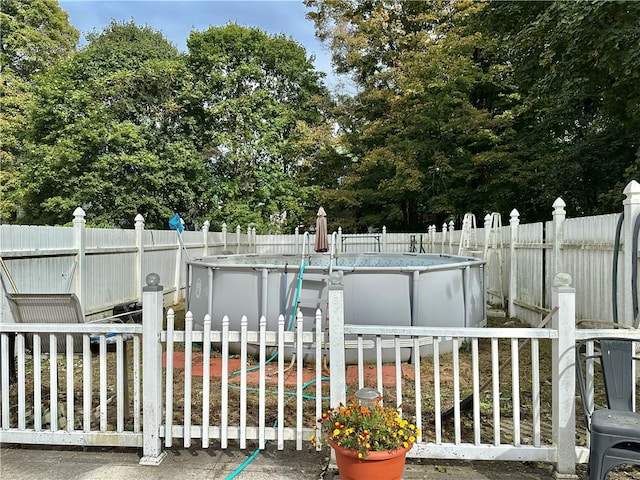 exterior space featuring a fenced in pool