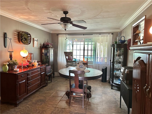 dining space featuring ceiling fan and crown molding