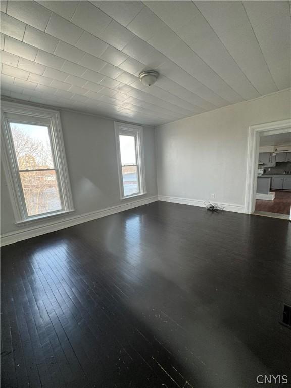 interior space with dark hardwood / wood-style flooring