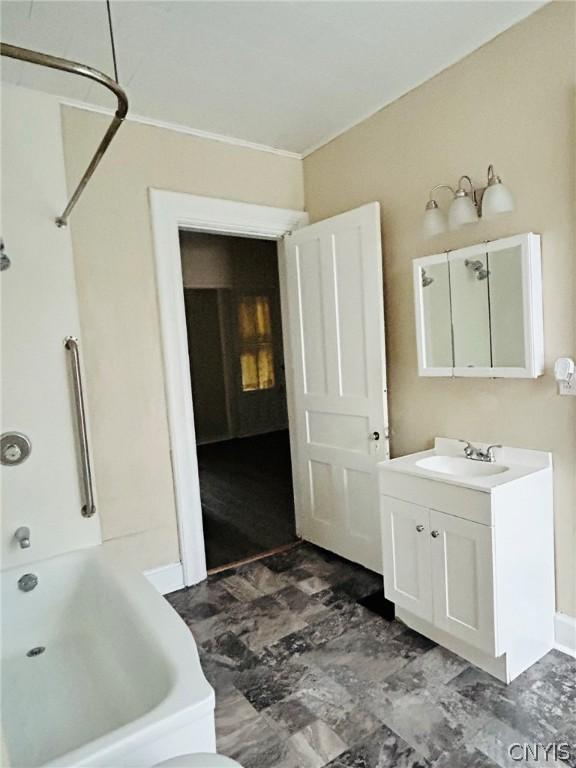 bathroom with tub / shower combination, tile flooring, and vanity