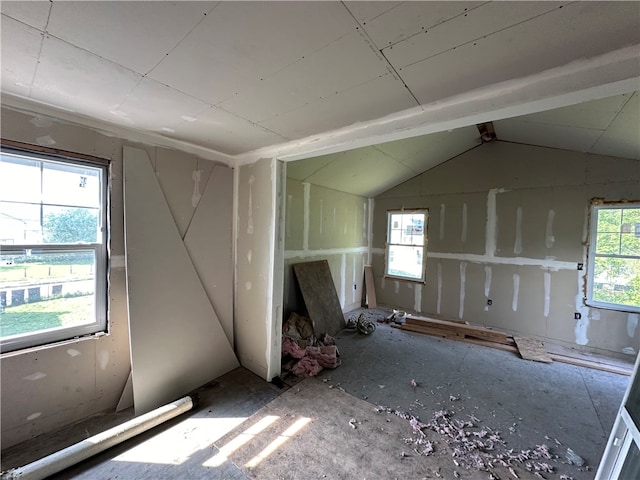 empty room with lofted ceiling