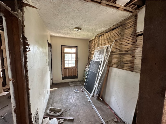 doorway featuring a textured ceiling