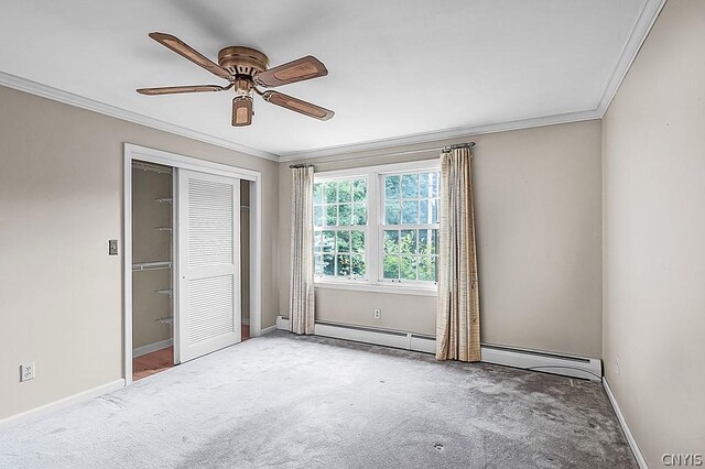 spare room with carpet floors, ceiling fan, and crown molding