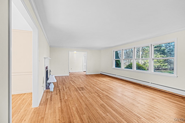 unfurnished living room with crown molding, light wood-type flooring, and baseboard heating