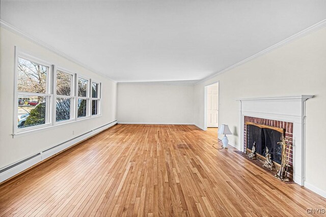 unfurnished living room featuring a fireplace, light hardwood / wood-style floors, a baseboard radiator, and ornamental molding