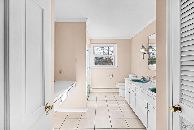 bathroom with tile patterned flooring, vanity, crown molding, and a baseboard radiator