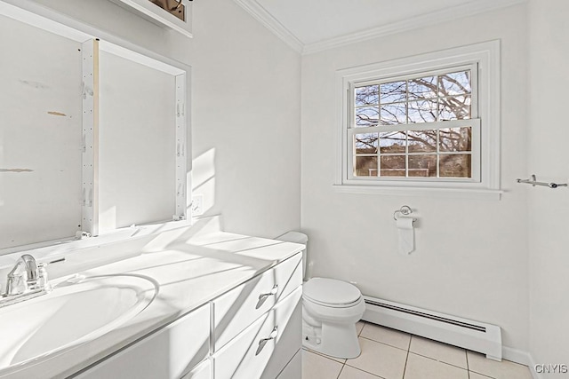 bathroom featuring toilet, baseboard heating, ornamental molding, vanity, and tile patterned flooring