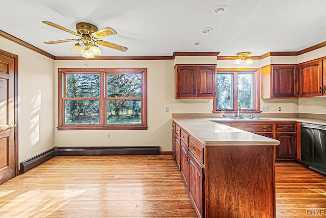 kitchen featuring light wood-type flooring, a healthy amount of sunlight, and sink