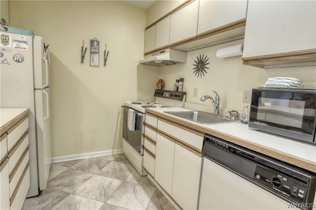 kitchen with sink, white cabinets, and white appliances