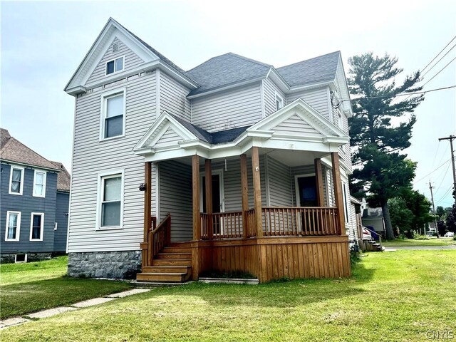 victorian home featuring a front yard