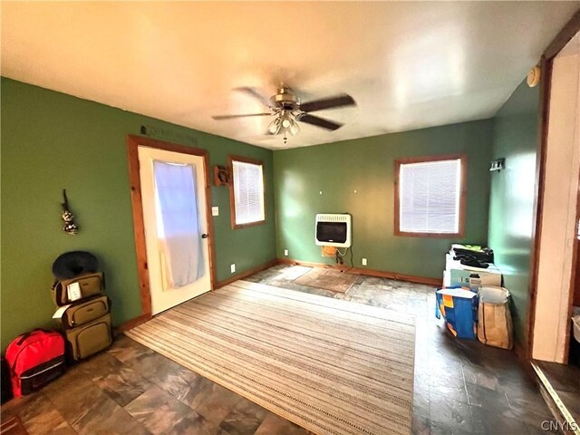 interior space featuring a healthy amount of sunlight, ceiling fan, and tile floors