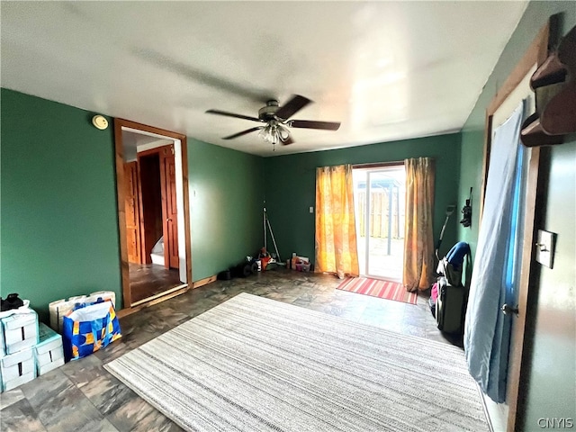 interior space featuring ceiling fan