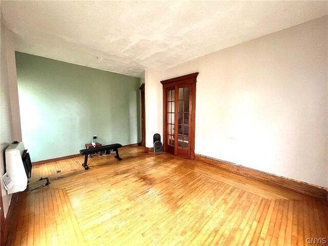 empty room featuring hardwood / wood-style flooring