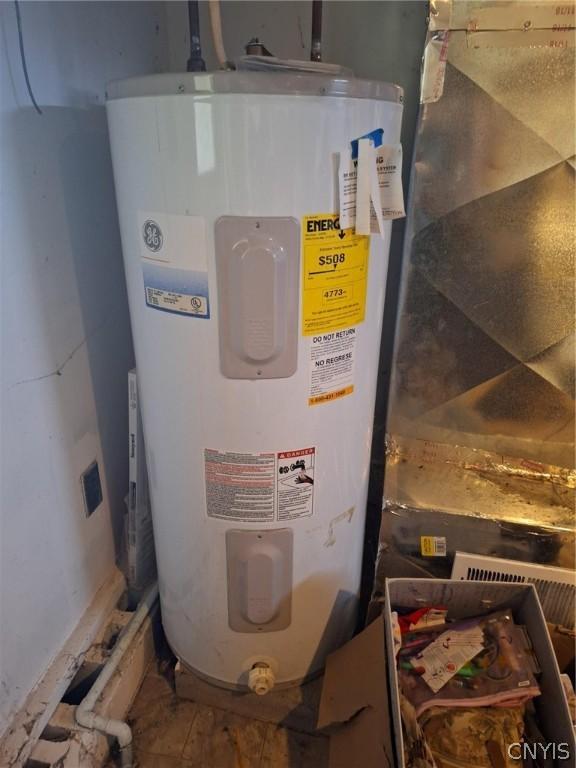 utility room featuring electric water heater