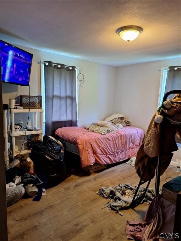 bedroom featuring hardwood / wood-style floors