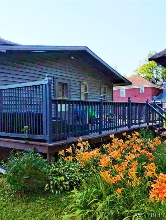 back of property featuring a deck