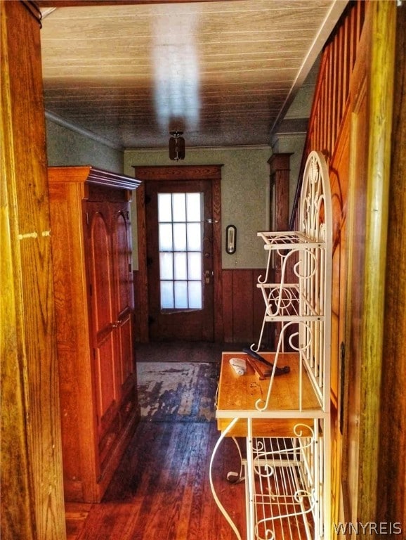 doorway featuring hardwood / wood-style flooring and wooden ceiling