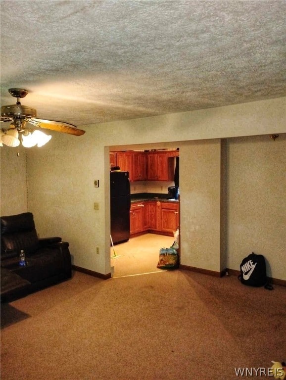 carpeted living room with ceiling fan