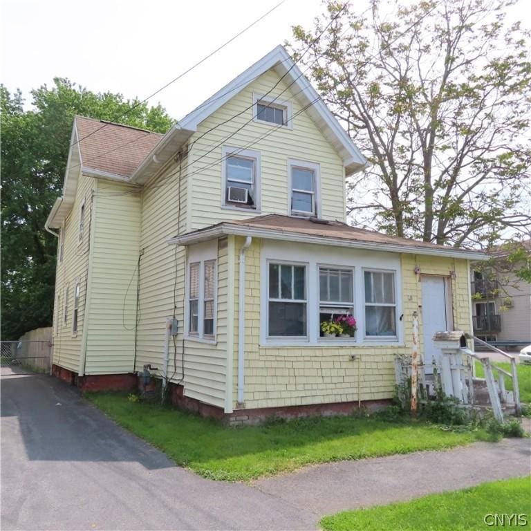 view of front of home with cooling unit