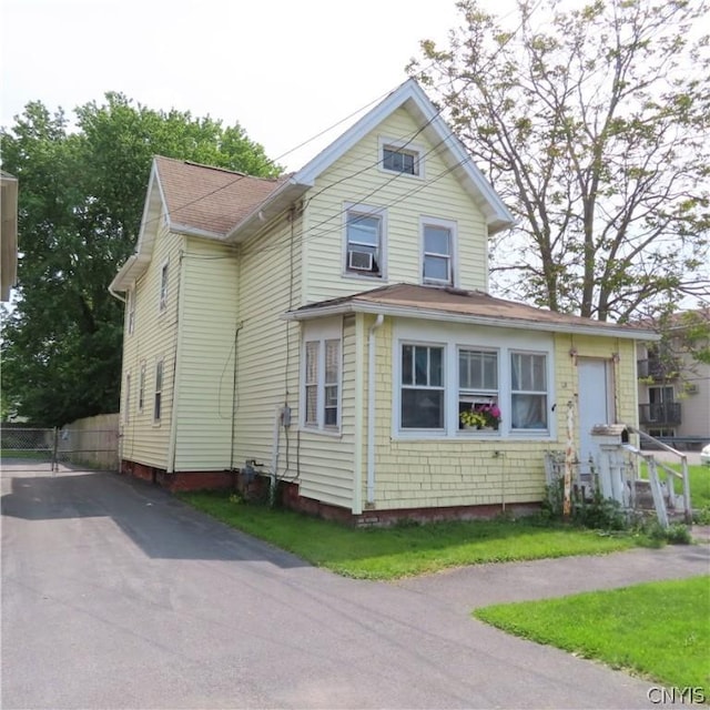 view of front of home featuring cooling unit