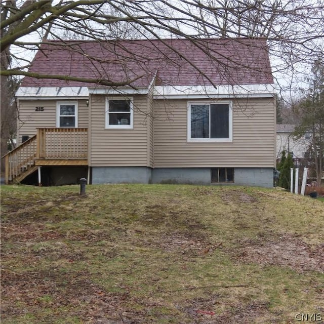 back of house with a yard and a wooden deck