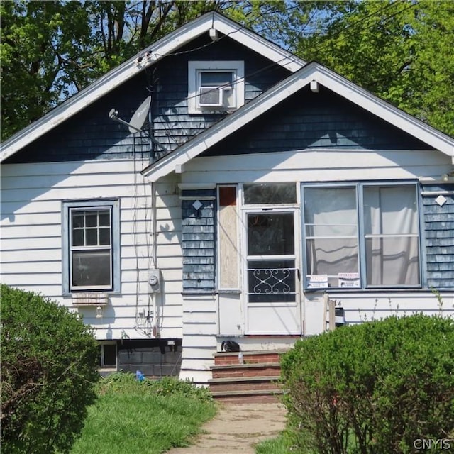 view of front of house with a sunroom