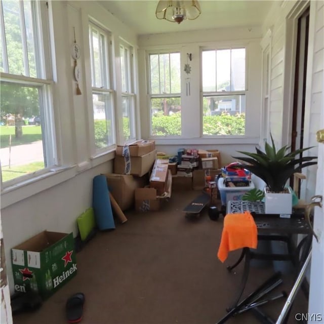 sunroom / solarium featuring a healthy amount of sunlight