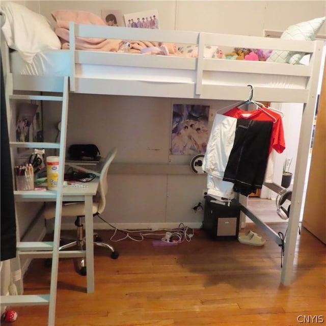 bedroom featuring wood-type flooring