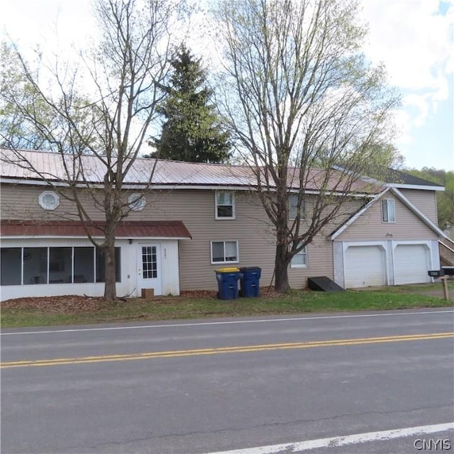 view of property exterior with a garage