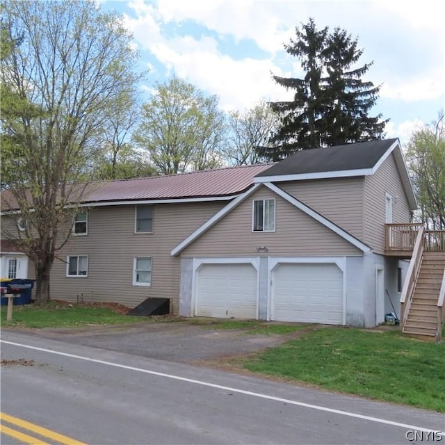 view of front of home with a garage and a deck