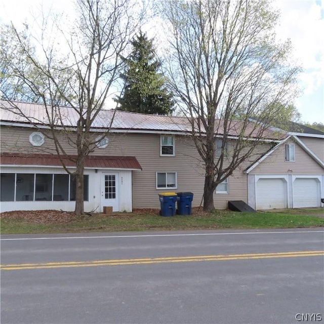 view of home's exterior featuring a sunroom