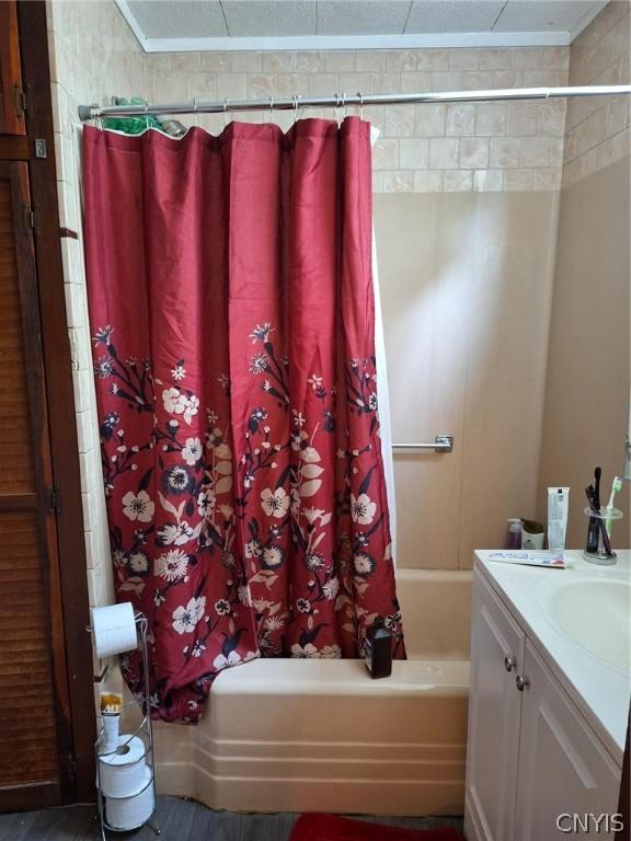 bathroom with vanity and shower / bath combination with curtain