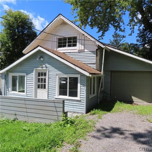 view of side of property featuring a garage