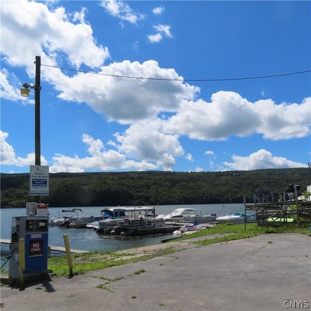 view of parking featuring a water view