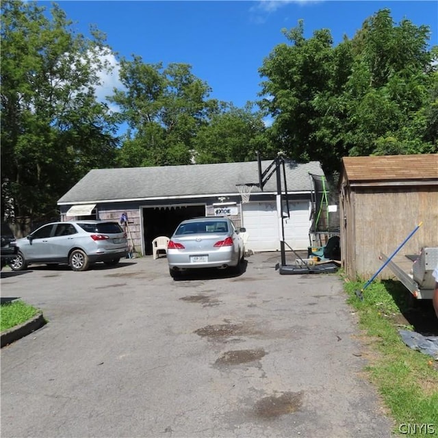 view of car parking featuring a garage